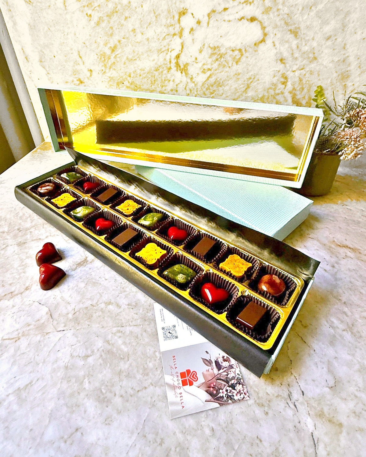 Limited edition Tiffany Blue 18-piece chocolate gift box open with gold-lined lid, Bella Choco Bella Hoboken